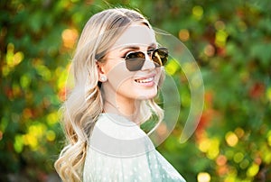 Spring romantic casual woman in sunglasses, portrait. Beautiful girl outdoor, close up beauty young female face. Young