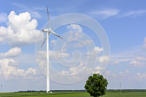 Spring landscape with wind turbine