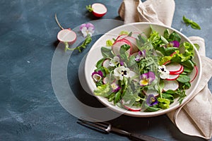 Spring salad with edible flower