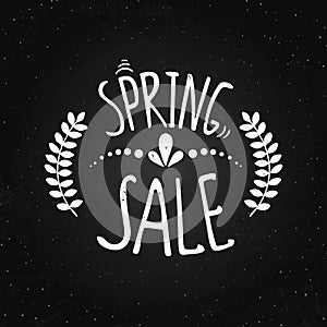 Spring sale - lettering on the chalk background.