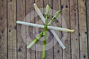 Spring season, new harvest of German white and green asparagus, bunch of raw green and white asparagus in basket with background