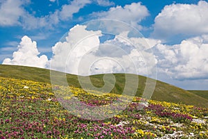 Spring season in the umbria mountains with blue sky and clouds