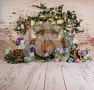 Spring sett up with colourful flowers pink, purple, turqoise and vintage wood parquet photo