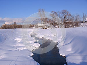 Spring in the Siberian village melted the river on a clear Sunny day