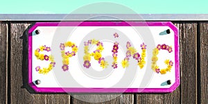 SPRING sign of yellow pink flowers collage, enamel, metal or pottery sign, wooden wall. frame, turquoise sky