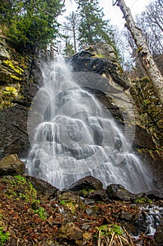 Spring snow melting in the waterfall. Bystre waterfall, Polana mountains, Slovak republic. photo