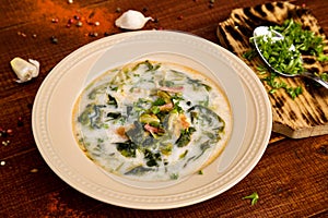 Spring soup with green salad, ham and omlette
