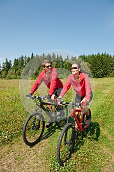 Spring - Sportive couple biking in nature photo