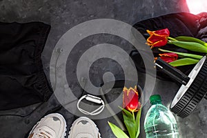 Spring sports flatlay composition, white sneakers, sport bra, leggins, fitness chest expander.Concept healthy lifestyle