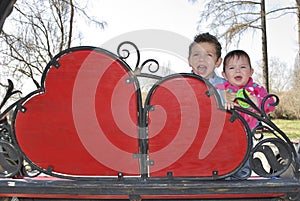 Spring on the street in a park near shops screaming boy and girl