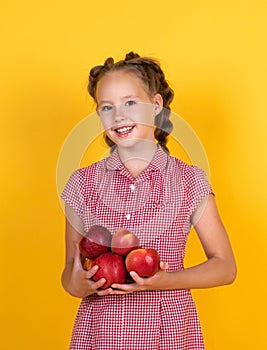 Spring style. happy girl holding apples from garden. kid hold fresh fruit. child eating red apple. summer healthy food