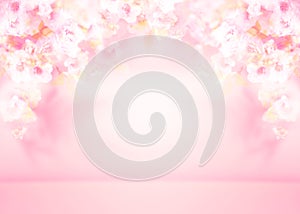 Spring summer blurred light pink background with shadow of the tree leaves and flowers on a wall. Abstract Spring Summer scene for
