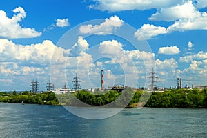 Spring and summer industrial view of Dnipro city on the bank of the Dnieper River on the background of beautiful clouds
