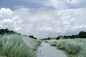 Spring summer landscape blue sky clouds Narew river boat green trees countryside