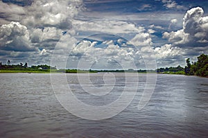 Spring summer landscape blue sky clouds Narew river boat green trees countryside