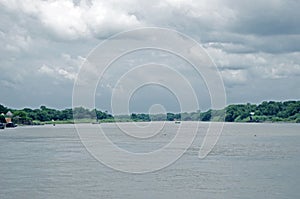 Spring summer landscape blue sky clouds Narew river boat green trees countryside