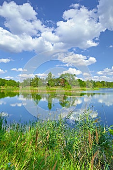 Spring summer landscape blue sky clouds river pond green trees