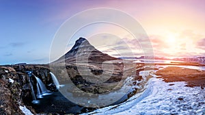 Spring sunrise over the famous Kirkjufellsfoss Waterfall with Kirkjufell mountain in the background in Iceland