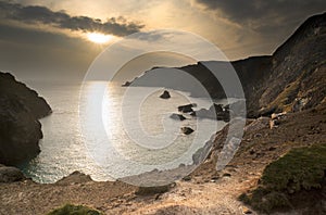 Spring sunset at high tide at Kynance Cove