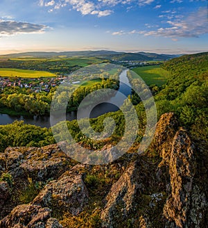 Spring sunset over meander of river Hron in Slovakia from extinct volcano, biotope of rare plants and flowers. photo