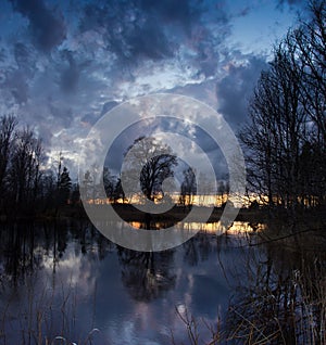 Spring sunset on the river Luga, Novgorod oblast ,Russia photo