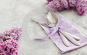 Spring table decoration with lilac flowers