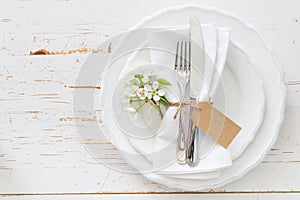 Spring table setting with white flowers