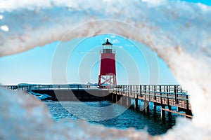 Charlevoix, MI /USA - March 3rd 2018:  Spring thaw at Charlevoix Michigans South Pier Lighthouse photo