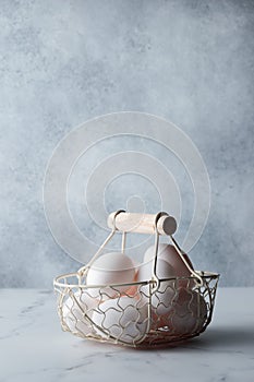 Spring time, easter holidays, white eggs in a basket