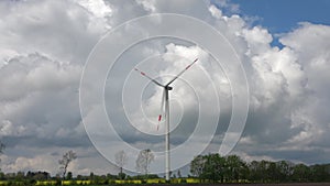 Spring view on alternative energy wind mills in a windpark