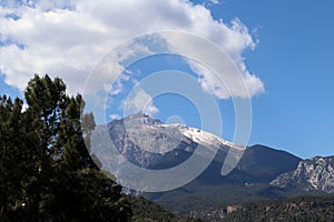 Spring view to the clouds over the snowy summit of Tahtali mountain from the Cirali beach, Turkey