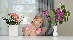 Spring violet flower portrait of a dreaming girl