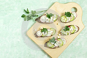 Spring vitamin toasts with cottage cheese, radish and cucumber