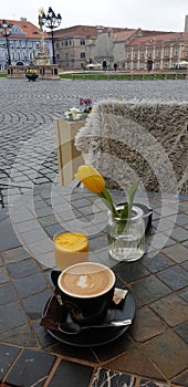 Spring weekend morning in Timisoara Romania at a coffee place in Unirii square Union square