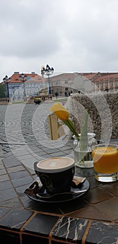 Spring weekend morning in Timisoara Romania at a coffee place in Unirii square Union square