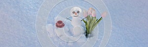 Spring or winter seasons banner. Snow man with cup coffee and spring flowers tulips. Happy smiling snowman on sunny