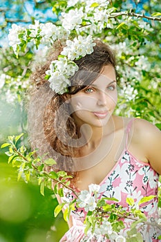 Spring Woman.Beautiful Girl model with spring flowers. Young Fem