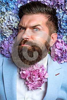 Spring. womens day. male with hydrangea flowers. Mature hipster with beard. Healthy hair and skin. brutal caucasian