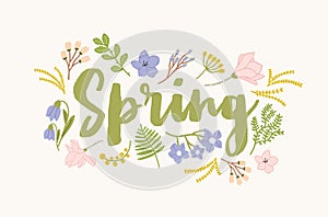 Spring word handwritten with elegant cursive calligraphic font and surrounded by beautiful blooming flowers and leaves