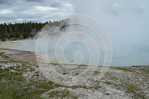 Spring in Yellowstone: Steam from Grand Prismatic Spring Obscures Midway Bluff in the Excelsior Group of Midway Geyser Basin