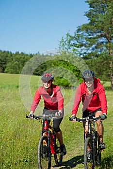 Spring - Young couple cycling in the nature