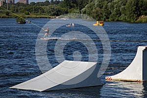 springboard on the surface of the reservoir for wakeboarding