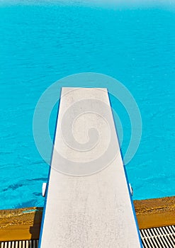 Springboard on swimming pool photo