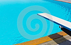 Springboard on swimming pool photo