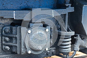 Springs in a railway carriage. The metal part of the train close-up.