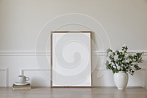 Springtime breakfast still life. Empty picture frame poster mockup. White ceramic vase with blooming apple tree branches