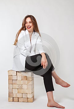 Springtime joy: A young woman\'s cheerful laughter in the studio