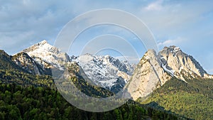 Springtime morning snowy Alps mountains panoramic scenic view
