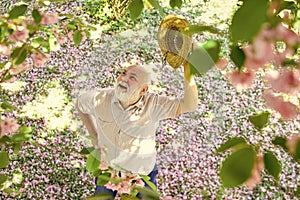 Springtime. old man imagining beautiful good things to realize further. mature man looking up with hope. happy man under