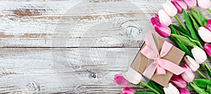 Springtime pink tulips on white rustic wooden boards photo